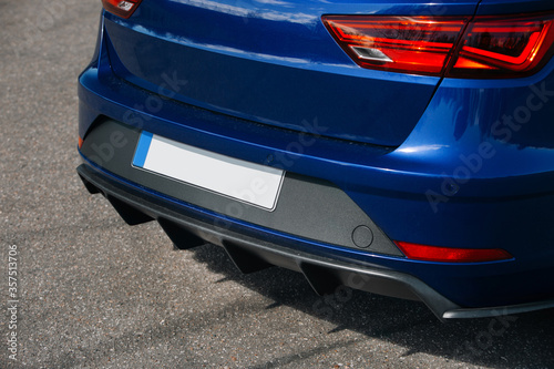 Rear bumper skirt and diffuser with ribs