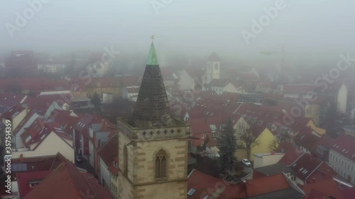 Wallpaper Mural Aerial shot of historic cathedral during foggy weather in city, drone is flying forward - Erfurt, Germany Torontodigital.ca