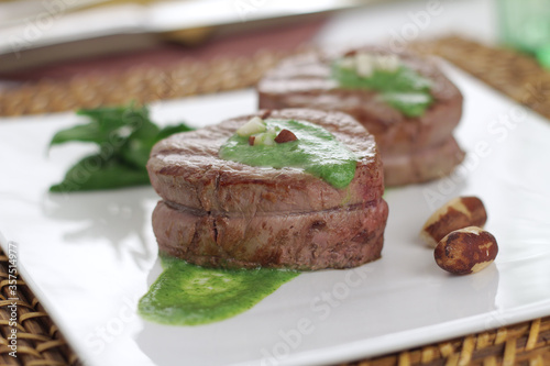 fillet medallion with spinach sauce and Brazil nuts