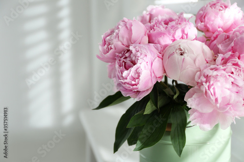 Bouquet of beautiful pink peonies indoors, closeup. Space for text
