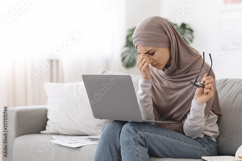 Tired Eyes. Exhausted Arabic Woman Exhausted After Working On Laptop At Home