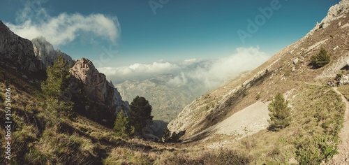 Photography Mesmerizing shot of the rocky mountains against the cloudy sky