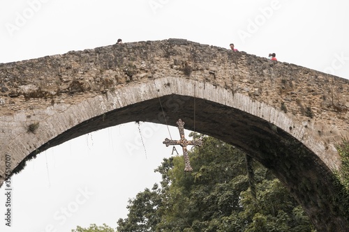 Old Roman stone bridge in Cangas de Onis over the river in Spain photo