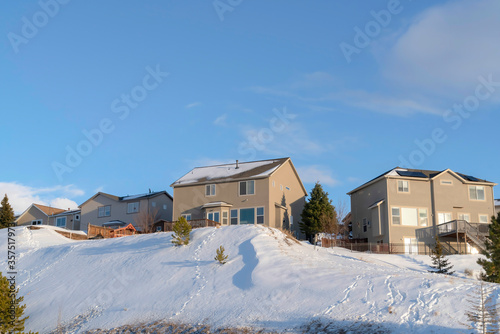 Mountain homes of Wasatch Mountains against blue sky on a sunny winter day