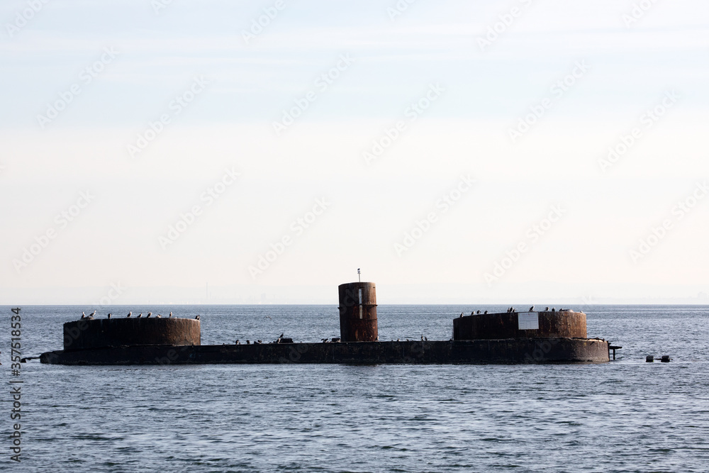 Fototapeta premium An old shipwreck abandoned stand on beach.