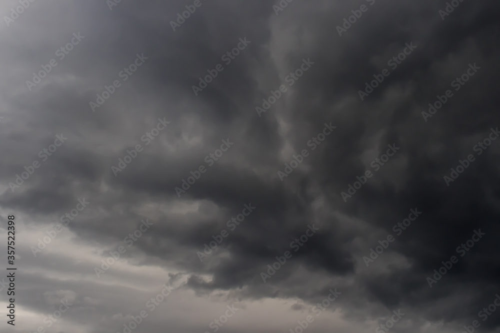 Dark contrasting cloudy rainy sky, clouds thicken, background