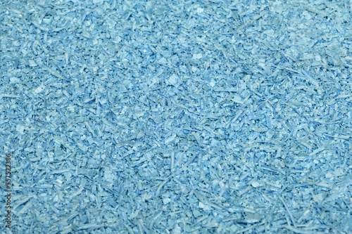 blue wooden filings, sawdust, cover the entire surface, texture