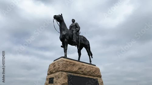 Tilt up reveals General Meade on horseback, leader of Union Army during Civil War at Gettysburg National Military Park statue photo