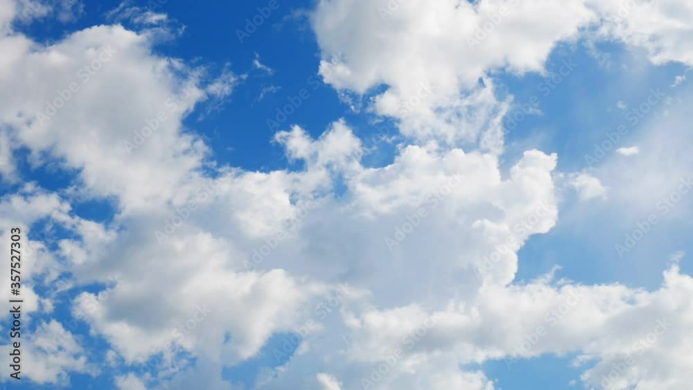 Timelapse of blue sky above puffy fluffy white cloud . Clearing day on day noon light and good windy weather Timelapse of blue sky above puffy fluffy white cloud . Clearing day on day noon light and good windy weather