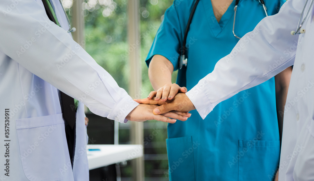 Doctor staff team stack hand together for motivate and agreement to do a work