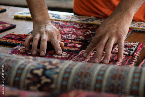 traditional hand sewing fixing old vintage antique persian carpet up close