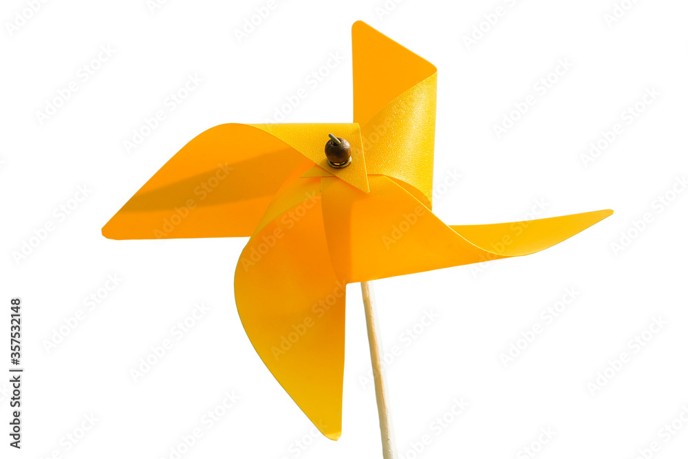 Yellow pinwheel or toy wind turbine isolated on white background.Clean energy concept Yellow pinwheel or toy wind turbine isolated on white background.Clean energy concept