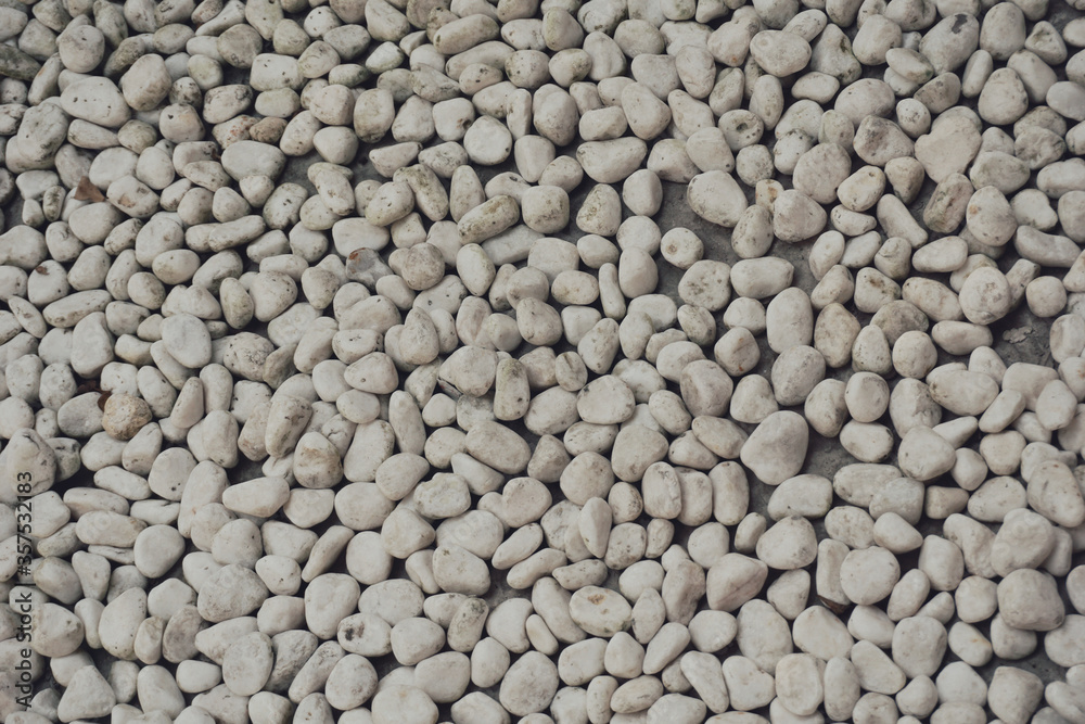 white pebbles stone texture background. Naturally polished white rock pebbles background white pebbles stone texture background. Naturally polished white rock pebbles background