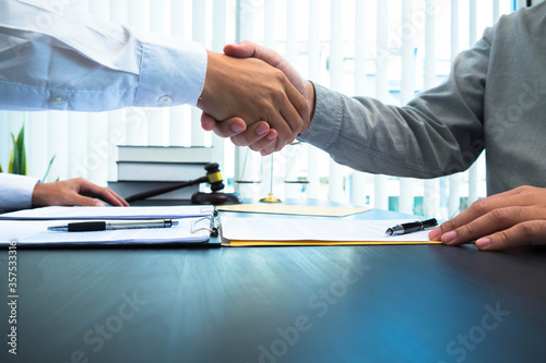 Shaking hands to congratulate the success of the credit purchase contract in the home buying business.