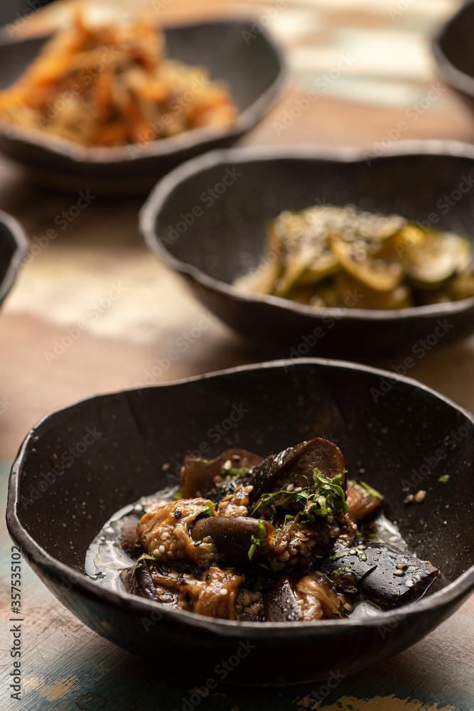 asian fermented kimchi fermented food eggplant on a black bowl and other ingredients on background asian fermented kimchi fermented food eggplant on a black bowl and other ingredients on background
