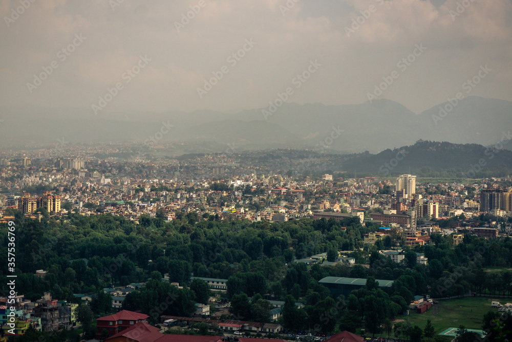 View to big city Kathmandu surrounded by mountains from the hill