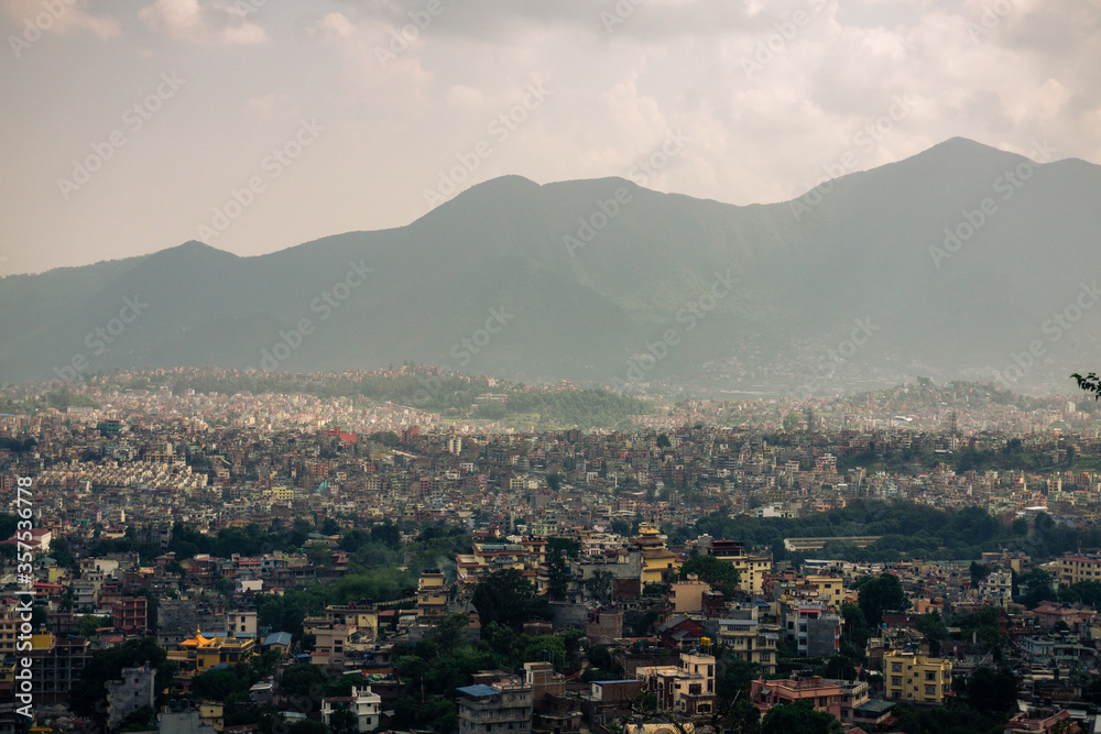 View to big city Kathmandu surrounded by mountains from the hill
