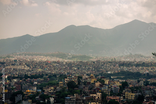 View to big city Kathmandu surrounded by mountains from the hill