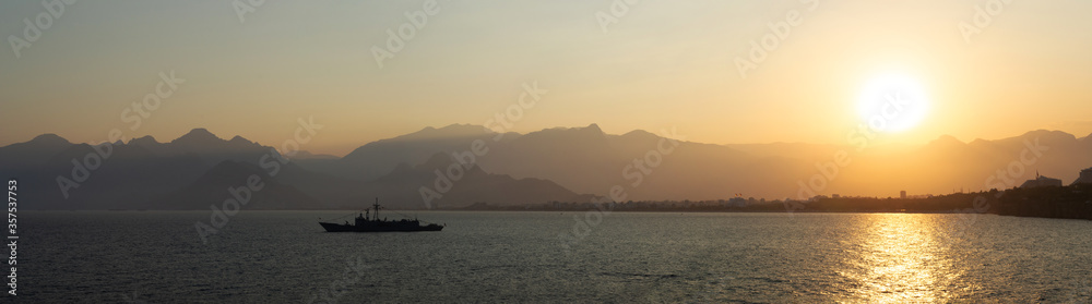 Sunset over Antalya mountains panorama 