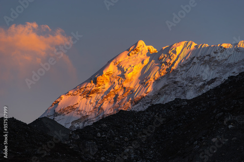 Evening sunset light over snow Himalaya mountain view from Chukung village, Everest base camp trekking route, Nepal