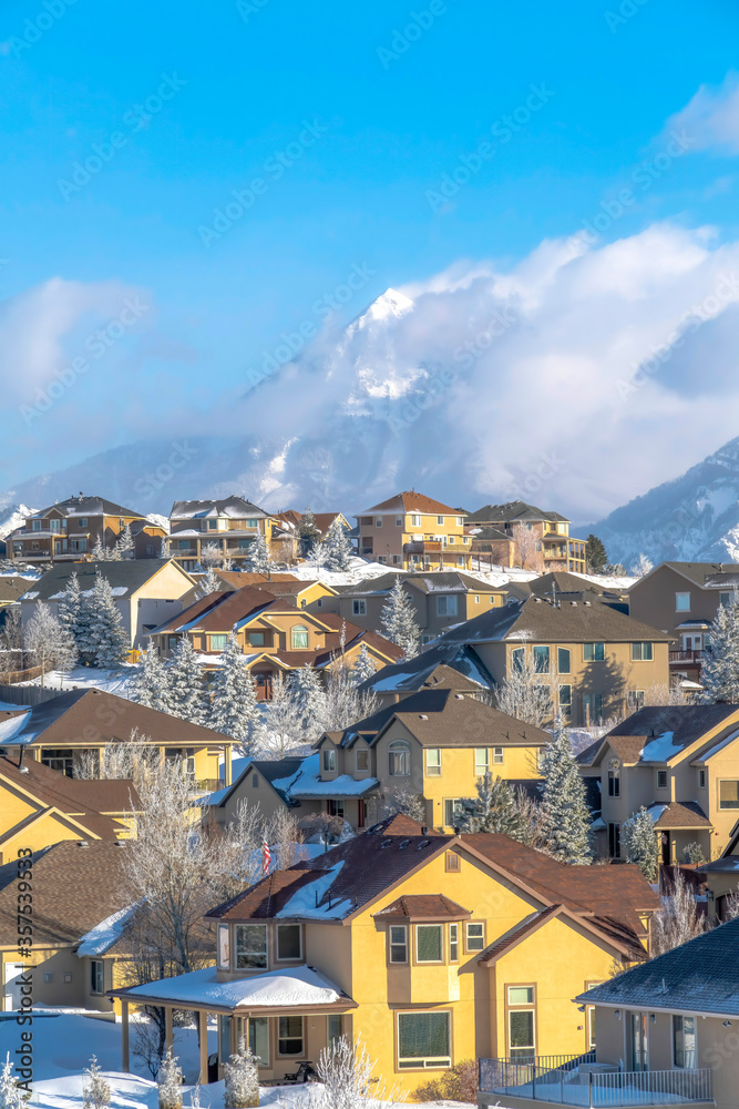 Scenic town with unobstructed view of towering snowy peaks of Wasatch Mountain