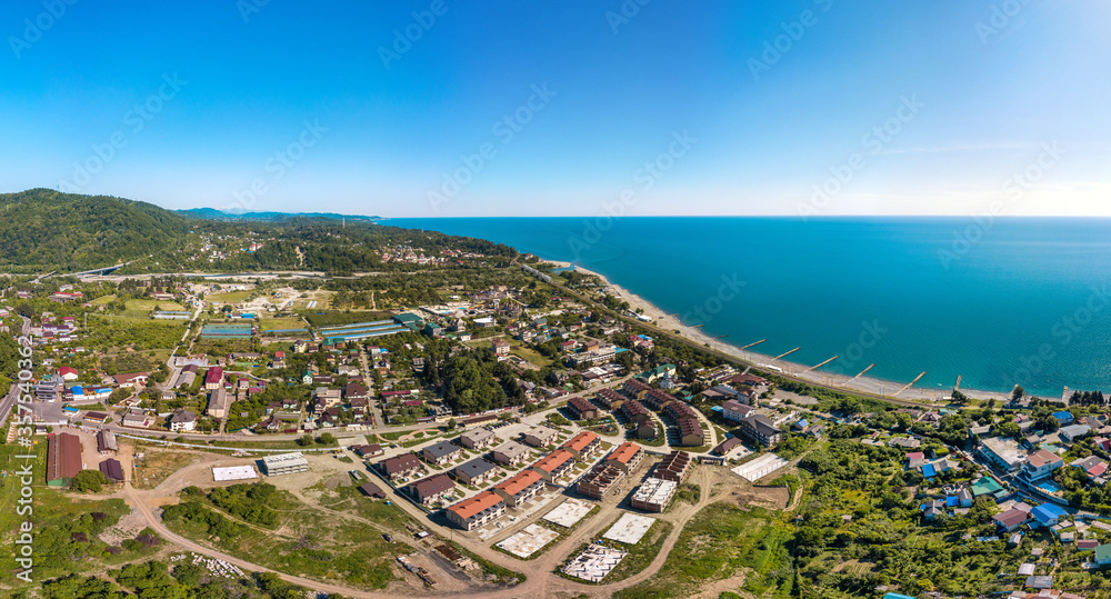 Golovinka, a small resort village within the borders of the city of Big Sochi in the forested mountains of the Western Caucasus near the Black Sea in southern Russia - aerial panorama on a sunny May
