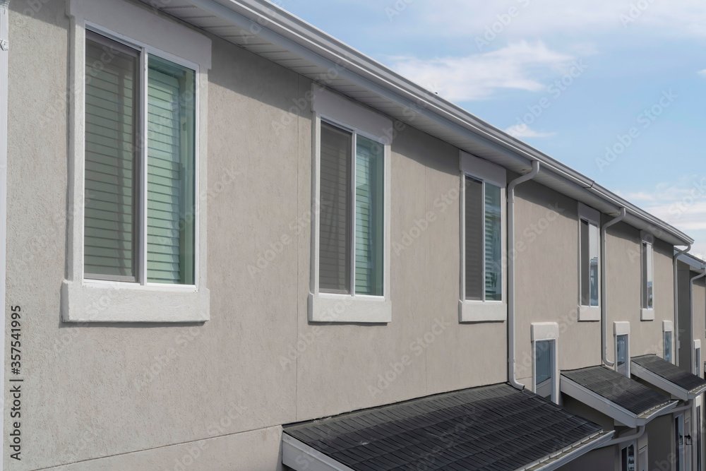 Exterior of a home in South Jordan CIty in Utah against cloudy blue sky