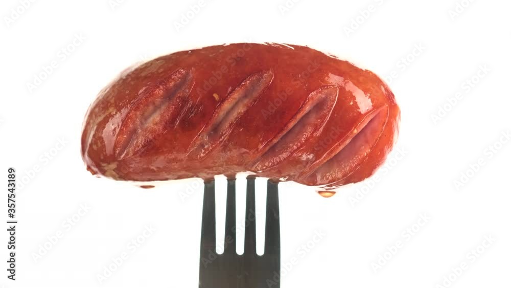 grilled sausage on fork white background