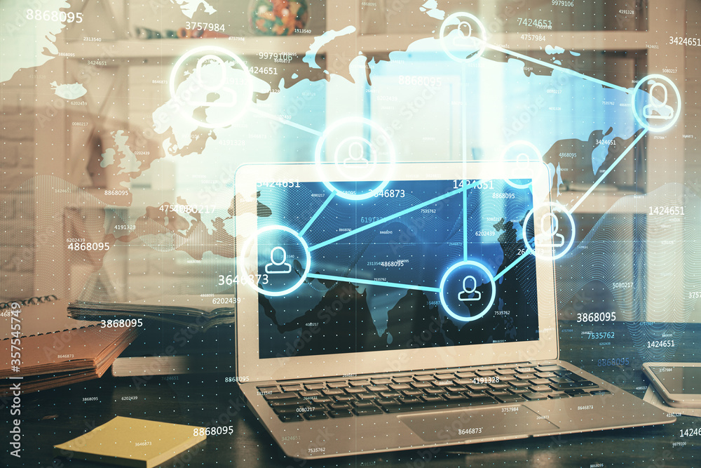 Computer on desktop with social network theme icon. Multi exposure. Concept of international connections. Computer on desktop with social network theme icon. Multi exposure. Concept of international connections.