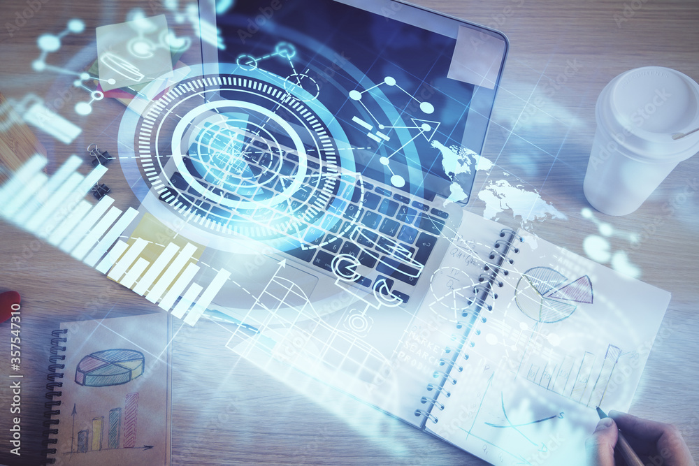 Double exposure of hands and notepad with business icons. Double exposure of hands and notepad with business icons.