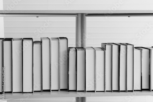 black and white book on bookshelf