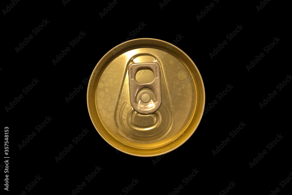 aluminum beer can lid,gold color isolated on a black background. aluminum beer can lid,gold color isolated on a black background.