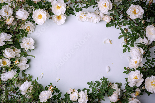 Rosehip flowers on a white table