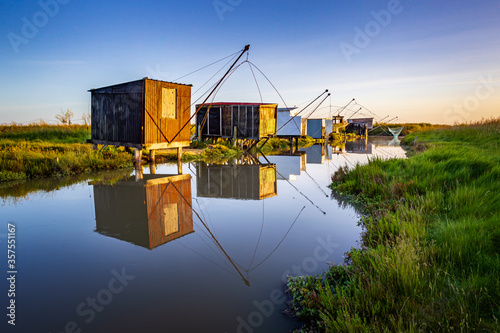 Reflection of fisheries on the marsh in Vendee photo