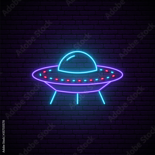 Neon UFO sign. Bright glowing spaceship icon on dark brick background. Vector illustration.