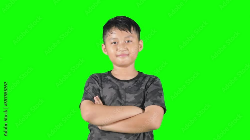 Confident little boy showing thumb up on studio Confident little boy showing thumb up on studio