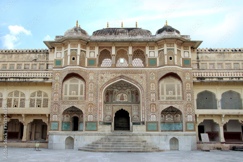 Fototapeta premium Jaipur, Rajasthan, India September 2014. gate is painted with vegetal colors. It was built in honor of the Mughal emperors. Amer Fort Ganesh Poll was built between 1611 and 1667. 