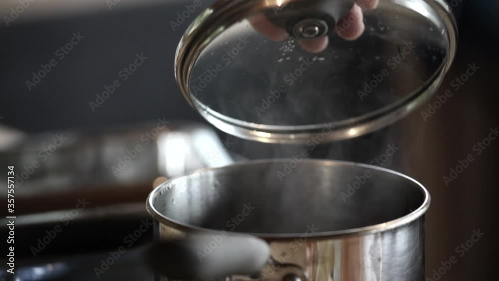 Checking steaming rice. Checking steaming rice.