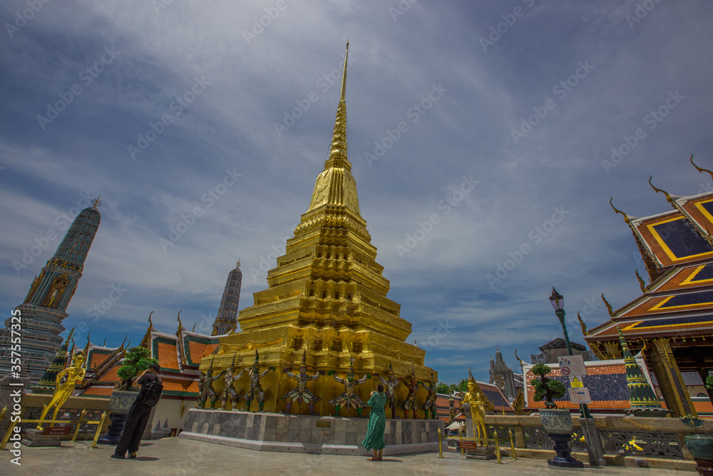 Fototapeta premium Temple of the Emerald Buddha - Wat Phra Si Rattana Satsadaram / Wat Phra Kaew-Bangkok: June 13, 2020, tourists visit to see the beauty of The Grand Palace, in Phra Nakhon District, Thailand.