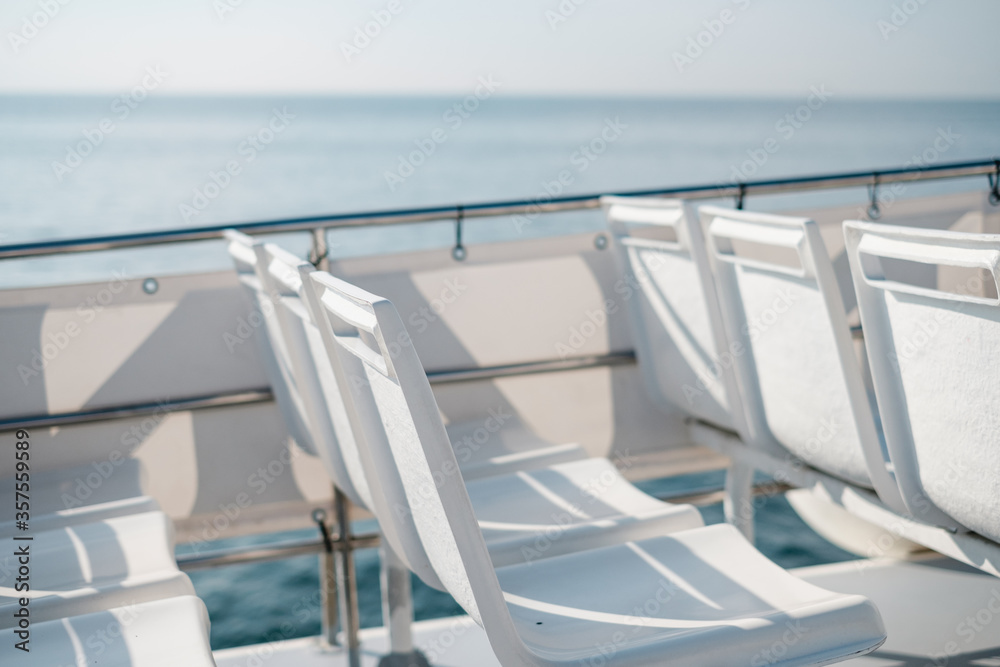Fototapeta premium deck chairs on the sea