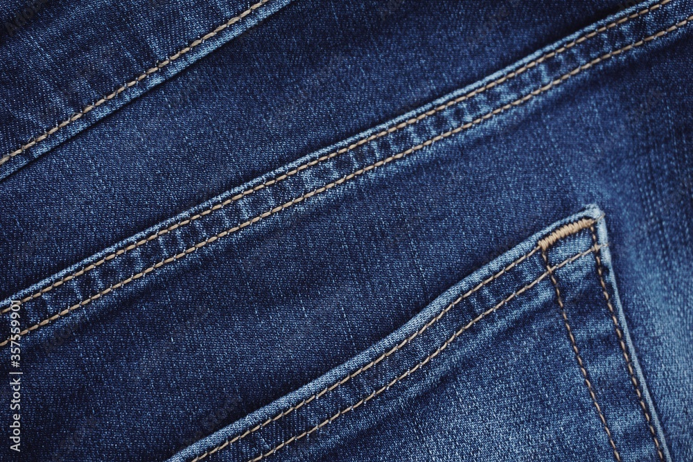 Close up of jeans fabric in a jeans pant. Jeans fabric texture. Close up of jeans fabric in a jeans pant. Jeans fabric texture.