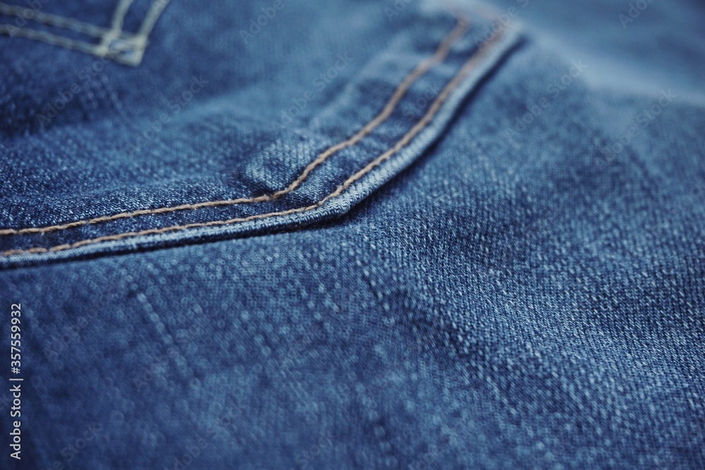 Fototapeta premium Close up of jeans fabric in a jeans pant. Jeans fabric texture.
