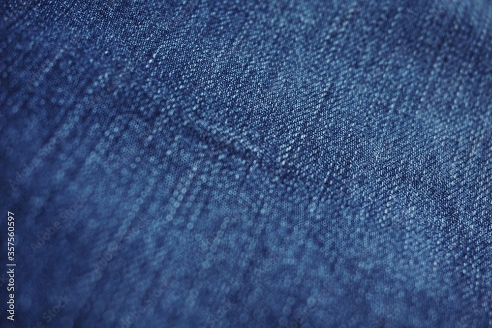 Close up of jeans fabric in a jeans pant. Jeans fabric texture.