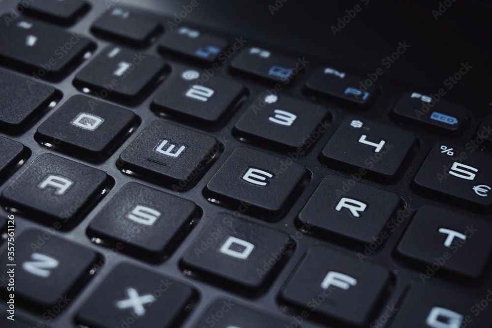 Close up of gaming laptop keyboard with futuristic font. Close up of gaming laptop keyboard with futuristic font.