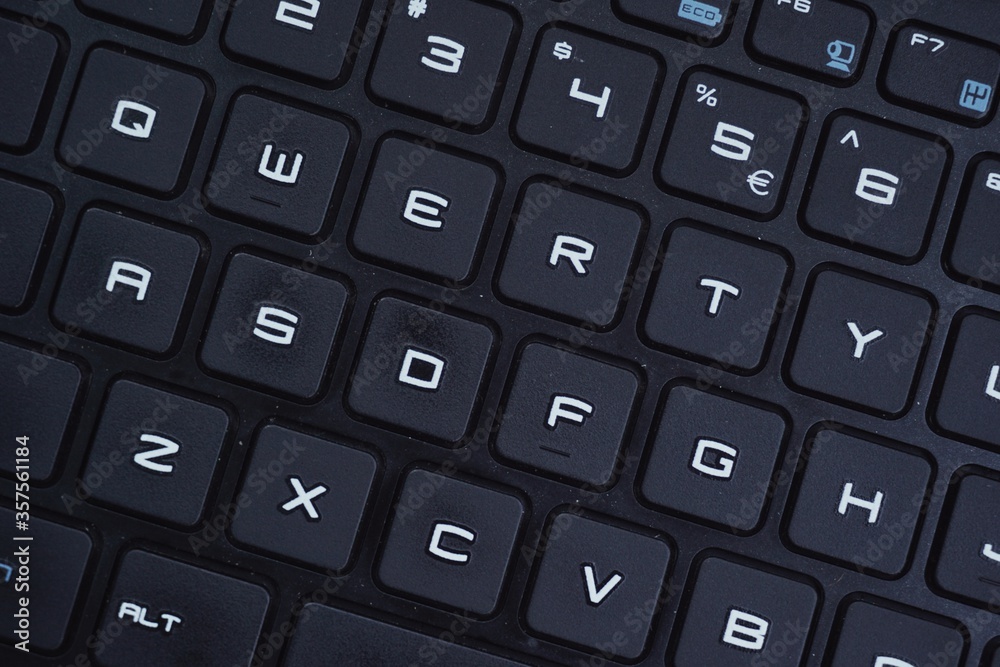 Close up of gaming laptop keyboard with futuristic font. Close up of gaming laptop keyboard with futuristic font.