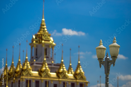 Background of tourist attractions where people come to see the beauty of the architecture of the golden pagoda in Bangkok  Wat Metal Prasat Or Wat Ratchanaddaram Worawihan  in Thailand