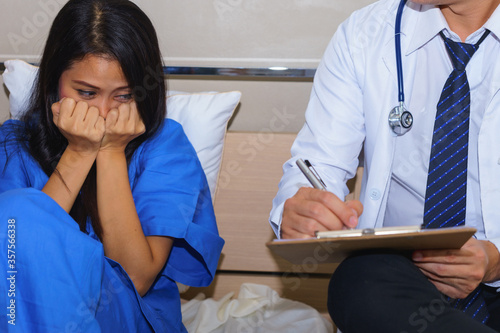 Mental disorder female patient is facing psychiatrist.