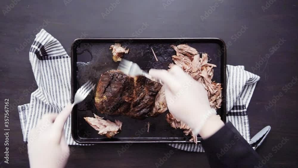 Flat lay. Step by step. Shredding pork roast shoulder with two forks.