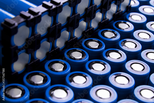 a bunch of 18650 elements, part of the elements is held together by holders