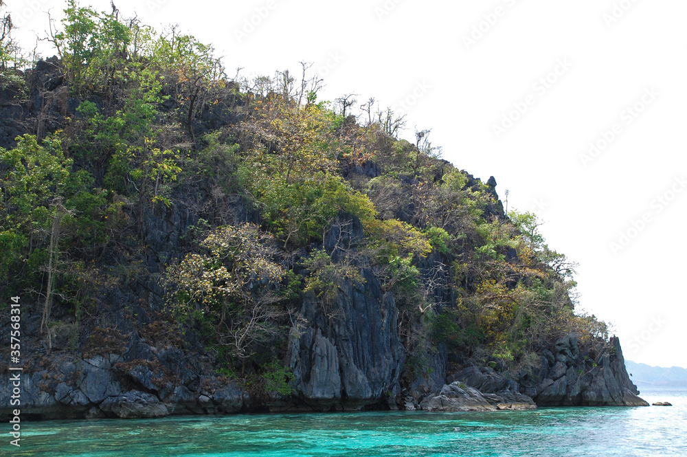Limestone rock formation and turquoise water sea